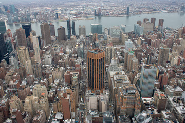 Obraz na płótnie Canvas Aerial view of Manhattan in New York City showing the classic high rise buildings and city scape in the USA