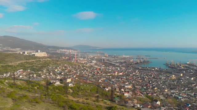 4k footage of the bay in Novorossiysk city. camera flight over the city of Novorossiysk from the mountains. View of the port, the bay and the city. Filming with drone