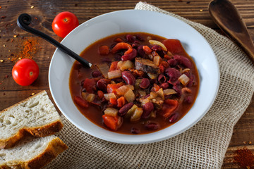 Country man stew from red beans, tomatoes and smoked sausages