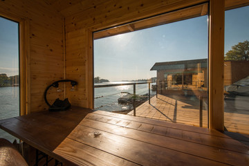 Obraz premium View through window od wooden river house