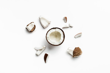 Pieces of coconut on white - obrazy, fototapety, plakaty
