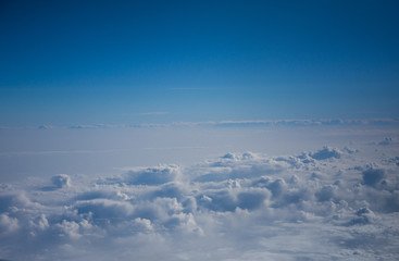 Fototapeta premium View from the airplane to the sky . Blue sky with clouds
