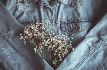 romantic jeans: denim jacket and white gypsophila flowers