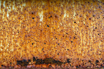 Texture of old painted metal wall with corrosion and cracked rusty surface