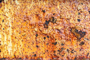 Texture of old painted metal wall with corrosion and cracked rusty surface