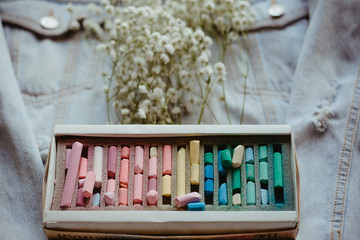 box with multicolored pastel crayons