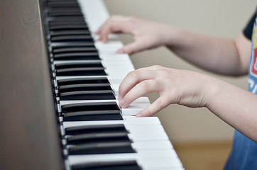 Fototapeta na wymiar Musician pianist hands on piano keys