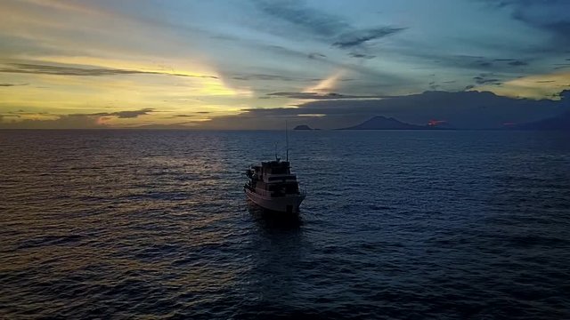 Drone pull away of dive boat on Coral Reef in Papua New Guinea