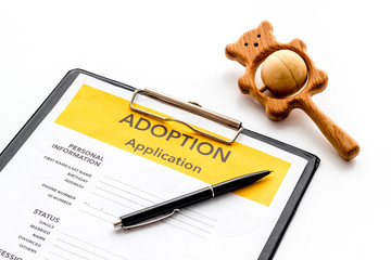 Application to adopt child with toy on white background