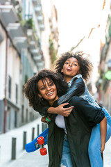 Mother Carrying her Daughter on the Back.