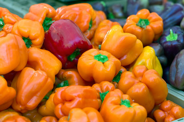 Fototapeta na wymiar orange sweet peppers at the market