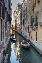 Fototapeta na wymiar Italy,canal of Venice with boats ,march, 2019