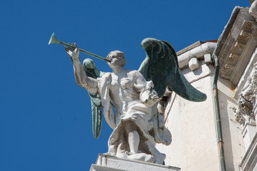  A Detail of an Angel with a trumpet at the facade of Santa Maria del Giglio church (Santa Maria...