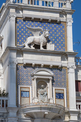 St Mark's Clock tower on Piazza San Marco, Lion of Saint Mark relief on facade, Venice, Italy.2019