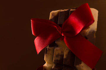 Chocolate bar gift with red bow. Love combined.