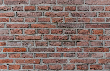 industrial red brick wall background in Europe. May be used in design and interiors.