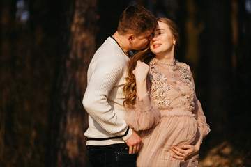 Beautiful portrait of a pregnant woman and her husband.