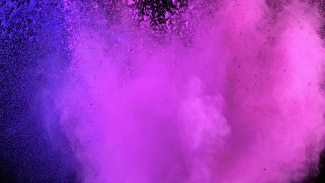 Super slow motion of coloured powder collision isolated on black background. Filmed on high speed cinema camera, 1000fps.