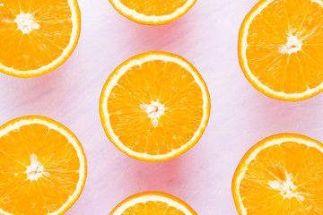 Background of oranges fruits. Many halves of fresh oranges, top view. Citrus for making juice. A lot of sliced oranges on white background. Concept