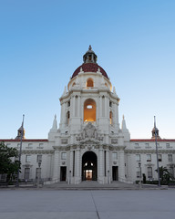 Fototapeta na wymiar Image showing the beautiful Pasadena City Hall under stunning morning light, with soft sun rays entering the tower and making it glow.