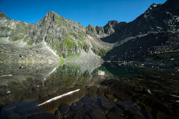 Fototapeta na wymiar Lake in the mountains of the Eastern Sayan