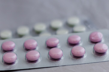 Pills for flu in the package close-up. The concept of treating colds, antidepressants, antibiotics, vitamin pills