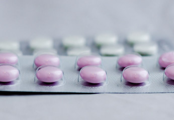 Pills for flu in the package close-up. The concept of treating colds, antidepressants, antibiotics, vitamin pills