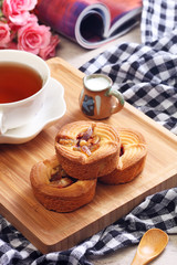Fototapeta na wymiar Pomelo cake with tea on wooden tray 