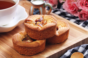 Pomelo cake with tea on wooden tray 