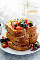 French toast with berries, maple syrup and coffee