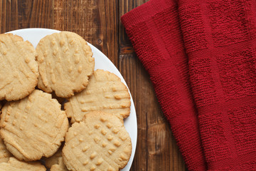 Home baked peanut butter cookies on wood.