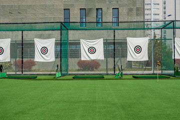 archery target rings during an archery competition. Green grass