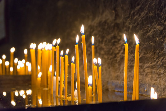 Sevan, Armenia - Jun 07 2018- Candle fire at Sevanavank Monastery. a famous Historic site in Sevan, Gegharkunik, Armenia.