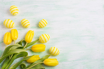 Easter yellow painted eggs and tulips, copy space
