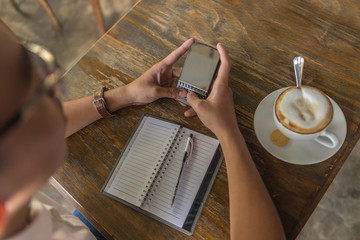 Student using phone to surf the Internet