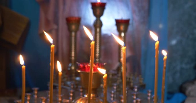 Holy candle light with dark background in the Church, Irkutsk Russia