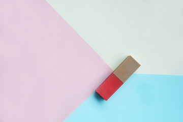 Red lipstick isolated on pastel background, Minimal makeup fashion concept.