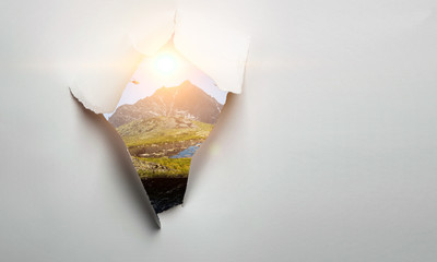 Paper torn hole effect on the wall. Mixed media