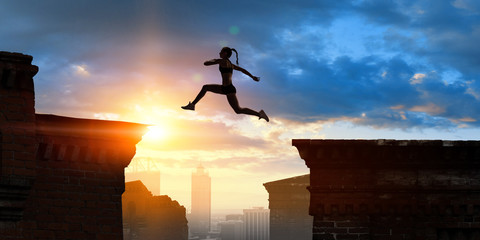Jumping over precipice, challenge concept.