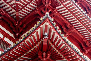 Fototapeta na wymiar Roof structure of The Buddha Tooth Relic Temple and Museum, Chinatown, Singapore . It is Chinese style architecture