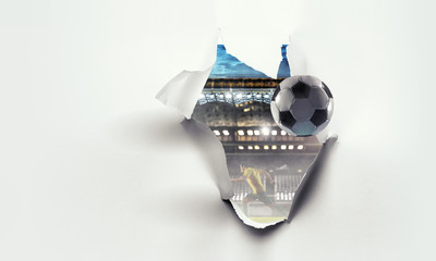Paper torn hole effect with stadium view. Mixed media