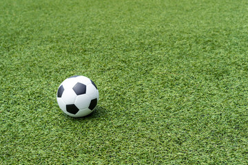 football field  soccer ball on green grass , soccer field  background texture