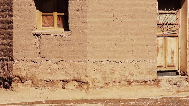 Little Boy Running Down a Dirt Street in the Andean Village of Susques, Jujuy Province, Argentina.  