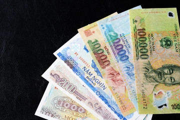 Vietnamese dong bills on a dark background close up. Money background