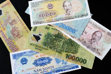 Vietnamese dong bills on a dark background close up. Money background
