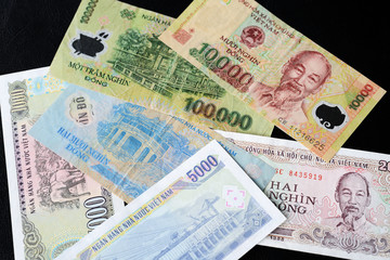 Vietnamese dong bills on a dark background close up. Money background