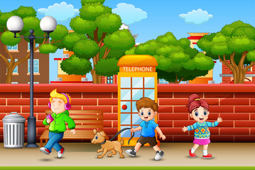 Happy children walking on sidewalk