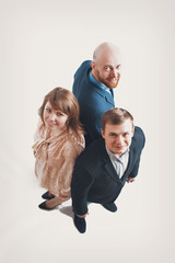 top view: three people back to back. Men and women in business suits