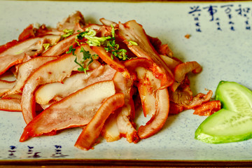 Chinese food sliced pork stew in a white plate Pig head meat