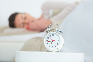 sleepy young woman waking up